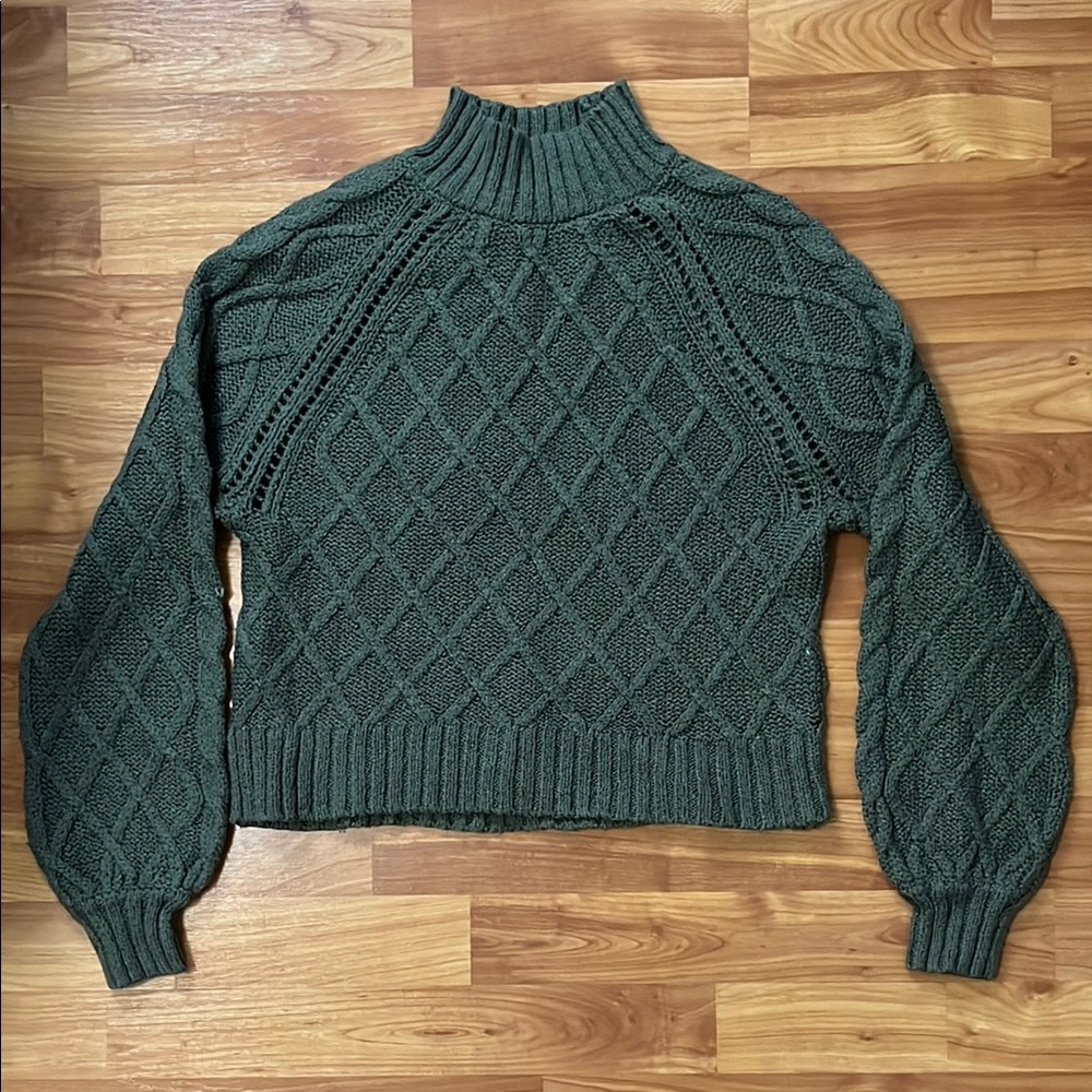 Green turtleneck sweater